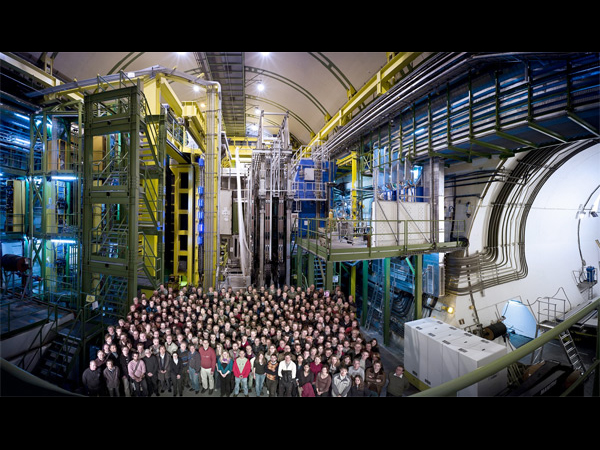 Huge teams of scientists are needed for our experiments. Here are some of the scientists behind (and in front of) one of the particle detectors that we work on.